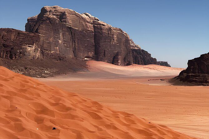 Discover Wadi Rum by 4x4 with a Bedouin guide - Overnight Wadi Rum: dinner, fire stories, sleeping under stars, and morning quiet