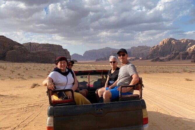 Wadi Rum Full Day Jeep Tour + Overnight in Bedouin Camp & Dinner - Lawrence’s Spring and Khazali Canyon: Oasis Cool and Rock-Wall Storytelling