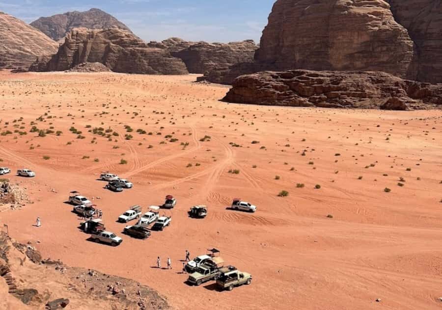 Wadi Rum:Full Day Tour Lunch Sand boarding Camel Ride Sunset - Getting started: meeting in Wadi Rum village and timing your day